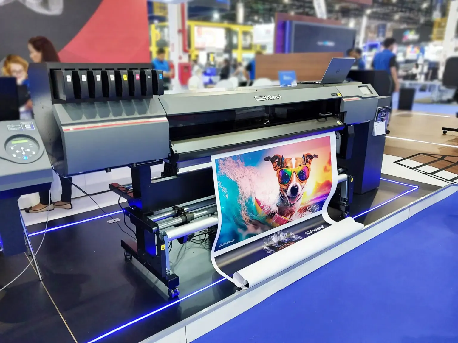 A showcase image of Catapult3's wide-format printing equipment in action, displaying a vibrant dog portrait to demonstrate the high-quality color reproduction and detail capabilities used for vehicle wraps, wall wraps, and signage projects.